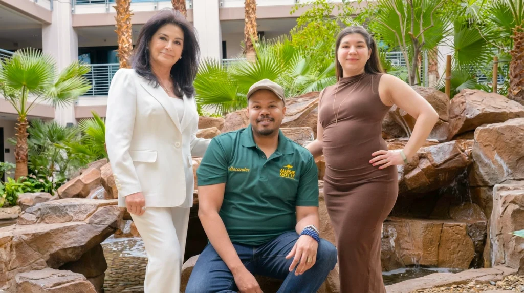 J Alexander of Aussie Got It Las Vegas house cleaning company posing with two clients at a Las Vegas resort